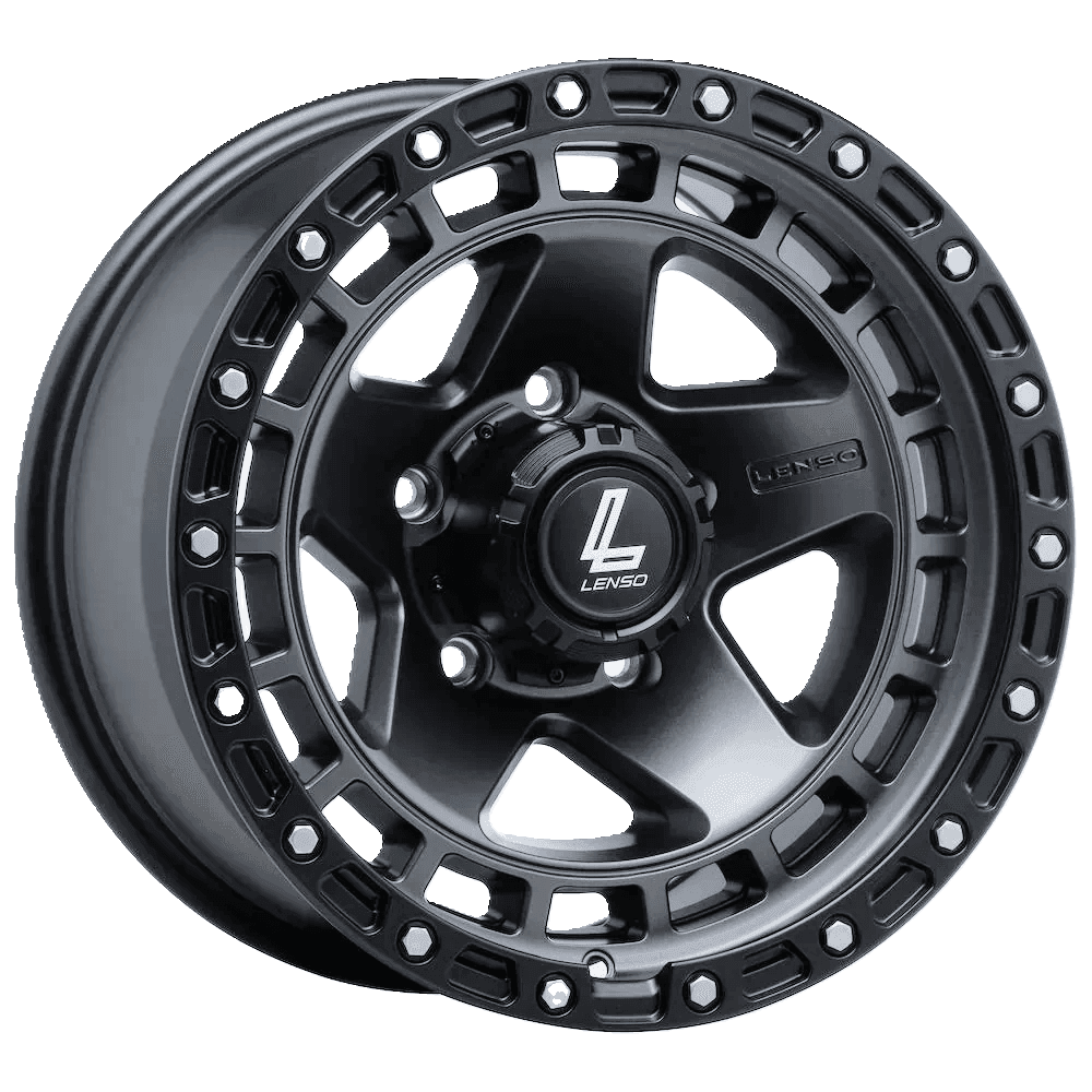 Close-up view of a black alloy wheel with intricate spoke design and logo at the center.